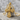 Star Cross Pendant, gold vermeil, product photo on stone