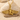 Winged Isis Goddess Pendant, gold vermeil, product photo on driftwood and shell