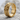 Flared Cross Ring, gold vermeil, angled product photo on stone surface