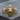 Growling Lion Head Ring, gold vermeil, front view on wood
