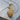 Feathered Eagle Head Pendant, gold vermeil, product photo on wood surface