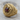 Coiled Ouroboros Dragon Ring, gold vermeil, angled view on wood surface
