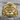 Monkey King Ring in gold vermeil, front view on weathered wood
