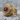 Red Stone Eagle Ring, gold vermeil, angled view on textured stone