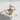 Treble Clef Ring in gold vermeil, front view on concrete surface
