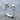 Twin Skull Ring, polished, angled view on rock surface