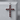Ruby cross pendant, polished silver, front product view on stone pedestal