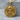Skull Guns Pendant, gold vermeil, product photo on stone display