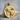 Bench Press Pendant, gold vermeil, front view resting on stone