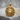 Square Lion Pendant, gold vermeil, front angle view on concrete block