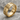 IC XC Nika Ring, gold vermeil, angled product photo on stone