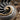 Nautilus Chamber Drop Earring, oxidized, close-up of spiral chambers