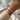 Moon Phase Ridge Bracelet in rose gold finish, worn on model wrist