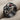 Garnet Fourfold Puzzle Ring in black rhodium, studio product photo