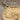 Melissa Bee Coin Pendant, close-up view of the bee relief and Greek inscription