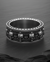 925 sterling silver heraldic skull ring featuring alternating skull and fleur-de-lis symbols on dark slate background