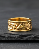 Gold vermeil horse ring with detailed flowing mane design on black stone background