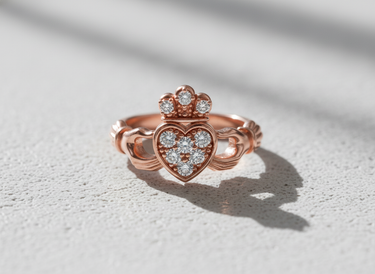 Rose gold plated 925 sterling silver Claddagh ring featuring pave set crystal heart and crown detail