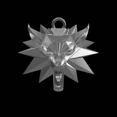 Close-up of Witcher wolf pendant highlighting fierce wolf face within star pattern