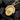 Humble Sparrow Pendant, yellow gold, front view on charcoal